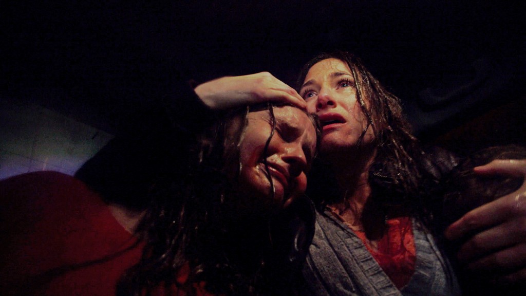 Olivia DeJonge and Kathryn Hahn stars in Universal Pictures' THE VISIT